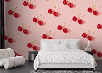 Fresh juicy cherries, creative fruit pattern, dusty rose pink background.  Wall mural