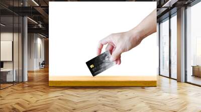 man handle realistic debit or credit card on wood table with isolated white background Wall mural