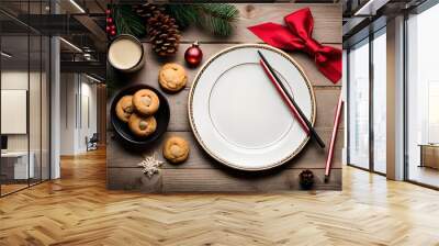 Top View showcasing a plate of freshly baked cookies, a glass of cold milk, and a handwritten note for Santa Claus, set on a cozy table Wall mural