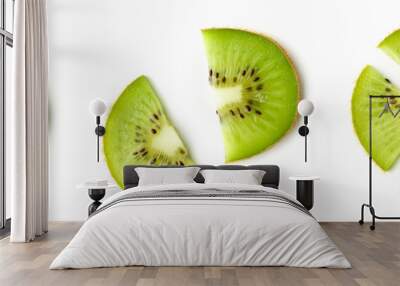 Kiwi fruit slices isolated on white, from above Wall mural