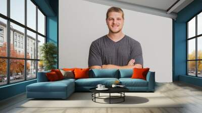 Handsome young man portrait in studio Wall mural