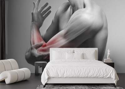 Man holds his elbow by the hand. Pain zone in the arm and bone illustration Wall mural