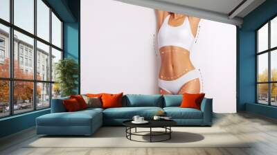 Woman body, cosmetic surgery and skin liposuction, body care, slender line of a female young body in underwear Wall mural