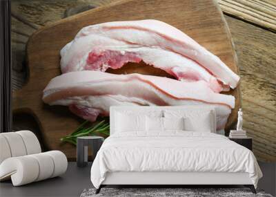 fresh raw streaky pork meat for cooking food, pork on wooden plate with rosemary, pork skin pig skin Wall mural