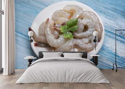 fresh shrimps or prawns , Seafood shelfish - raw shrimp on white plate and wooden background for cooking Wall mural