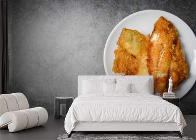 fried fish fillet sliced for steak or salad cooking food , top view copy space - tilapia fillet fish crispy served on white plate Wall mural