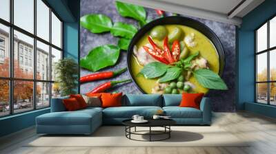 Green curry chicken cuisine asian food on the table - Thai food green curry on soup bowl with ingredient herb vegetable on dark plate background Wall mural