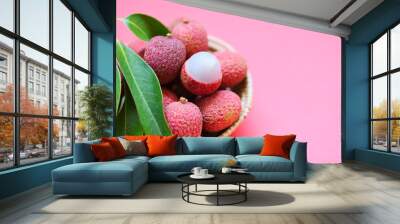 Lychee slice peeled on red pink background - Fresh lychee with green leaves harvest in basket from tree tropical fruit summer in Thailand Wall mural