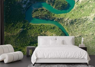 aerial view of a picturesque river meandering among the hills Wall mural