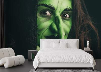 Evil witch holding an invisible item Wall mural