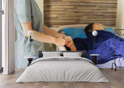 Asian families visit elderly woman patient hand holding hand at the hospital ward. Wall mural