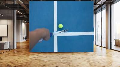 Tennis racket and tennis ball on blue court Wall mural