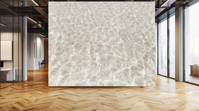 Top view surface of clear sea water reflections on shallow sandy beach. Wall mural