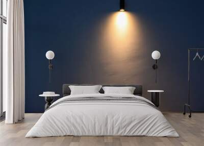 Glowing modern wall led lamp with warm light on white wall. Free space. Wall mural