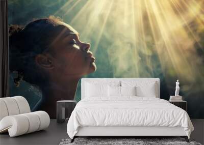 african american woman praying with faith gods light shining down spiritual devotion concept photo Wall mural