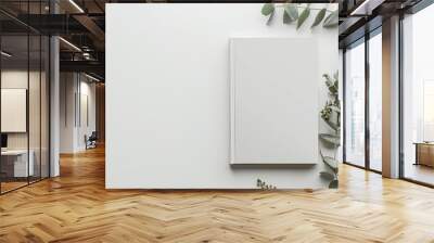 blank white book cover mockup with eucalyptus branch elegant minimalist flat lay composition on white table Wall mural