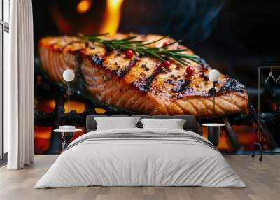 grilled salmon steak with rosemary and pepper on flaming barbecue grill closeup Wall mural