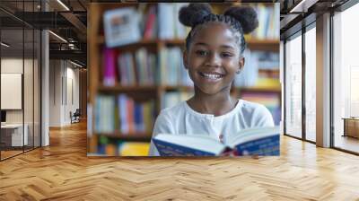 happy african american schoolgirl reading book in classroom library inclusive education Wall mural