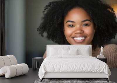 joyful young african american woman sitting comfortably radiating positivity and confidence natural lighting enhances her warm smile and expressive features Wall mural