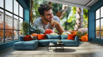 modern young man enjoying tropical fruits at rustic table healthy lifestyle concept stock photo Wall mural