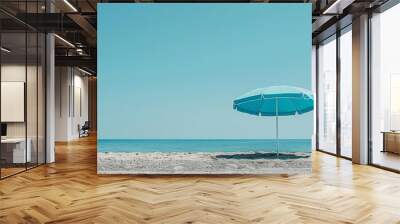 tranquil blue beach umbrella against clear sky minimalist coastal photography Wall mural