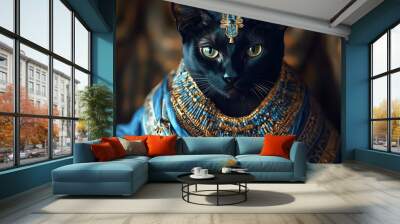 Blue-dressed ancient black cat captured in portrait picture Wall mural