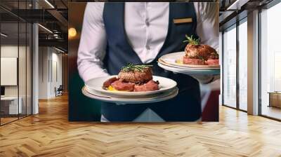 waiter holding a tray of strawberries, lamb chops with vegetables, Waiter carrying plates with meat dish on some festive event, party or wedding reception restaurant Wall mural