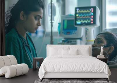 young indian female doctor examining and older patient Wall mural