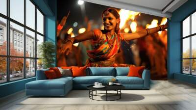 Young woman in traditional wear and performing garba dance in navratri festival Wall mural