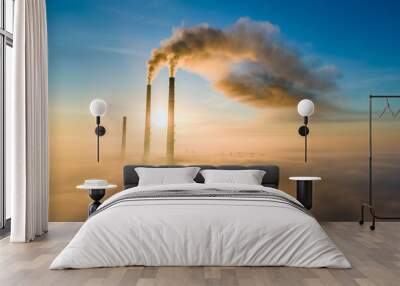 Aerial view of coal power plant high pipes with black smoke moving up polluting atmosphere at sunset. Wall mural