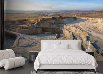 Aerial view of open pit mining site of limestone materials for construction industry with excavators and dump trucks Wall mural