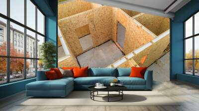 Construction of new and modern modular house. Walls made from composite wooden sip panels with styrofoam insulation inside. Building new frame of energy efficient home concept. Wall mural