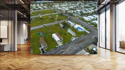 Destroyed RV camper vans and and mobile homes after hurricane in Florida residential area. Consequences of natural disaster Wall mural