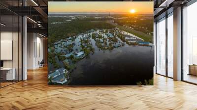 Heavy flood with high water surrounding residential houses after hurricane Ian rainfall in Florida residential area. Consequences of natural disaster Wall mural