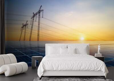 High voltage pylons with electric power lines transfering electricity from solar photovoltaic sells at sunrise. Production of sustainable energy concept. Wall mural