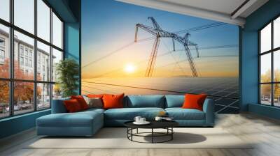 High voltage pylons with electric power lines transfering electricity from solar photovoltaic sells at sunrise. Production of sustainable energy concept. Wall mural