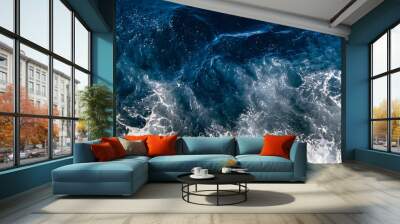 Top down aerial view of sea water surface. White foam waves texture as natural background. Wall mural