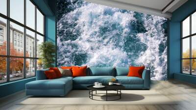 Top down aerial view of sea water surface. White foam waves texture as natural background. Wall mural