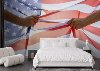 Two human hands holding USA national flag. Celebration of United States independence day concept. Wall mural