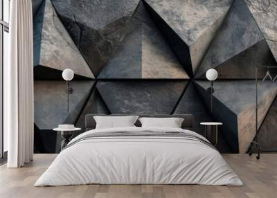 A wall with a slate texture, comprising 3D triangular panels in black. Wall mural