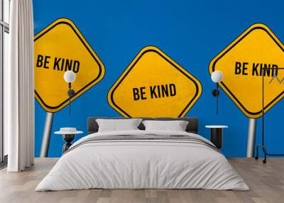 be kind - yellow sign with blue sky Wall mural