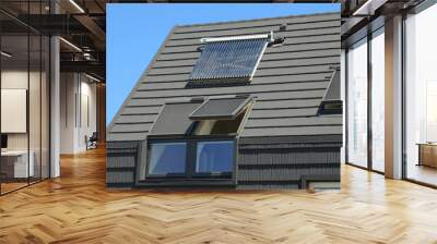 Modern house rooftop with attic panoramic windows. Attic skylight windows. Wall mural