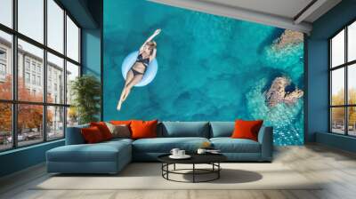 Aerial view at the girl on sea. Turquoise water from air as a background from air. Natural seascape at the summer time. Seascape from drone Wall mural