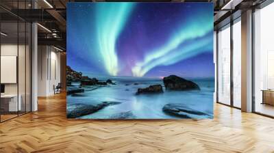 Aurora borealis on the Lofoten islands, Norway. Night sky with polar lights. Night winter landscape with aurora and reflection on the water surface. Natural background in the Norway Wall mural