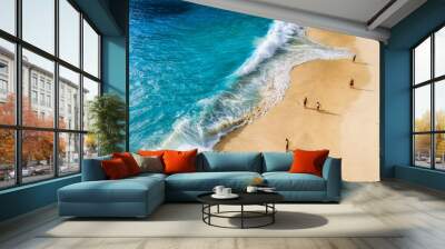 People on the beach on Bali, Indonesia. Vacation and adventure. Beach and large waves. Top view from drone at beach, azure sea and relax people. Travel and relax - image Wall mural