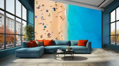 People relaxing on the beach during their vacation. Blue sea water. Summer landscape from drone. Aerial landscape. Wall mural