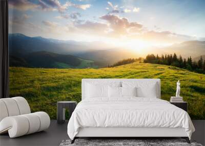 Sunset in the mountain valley. Beautiful natural landscape in the summer time Wall mural