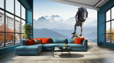 tourist in mountain peak. active life concept Wall mural