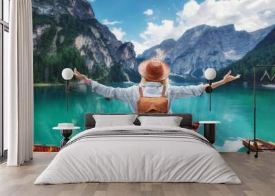 Traveler look at the mountain lake. Travel and active life concept. Adventure and travel in the mountains, .Lago di Braers lake, Dolomite Alps, Italy. Wall mural