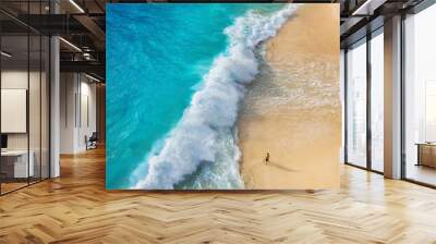 View of a man on the beach on Bali, Indonesia. Vacation and adventure. Top view from drone at beach, azure sea and relax man. Travel and relax - image Wall mural